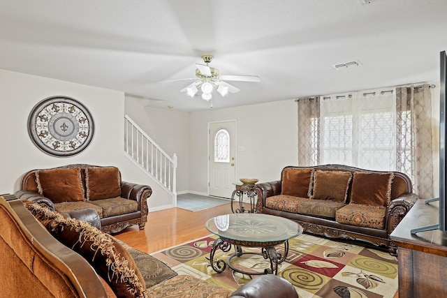 2312 Bantry Ln, Arlington, TX 76002 - living area with stairs, wood finished floors, ceiling fan, and baseboards