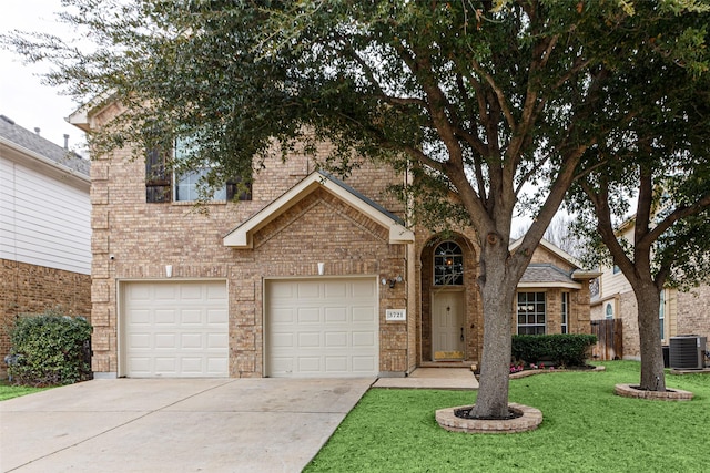 view of front facade featuring central AC, a front yard, and a garage