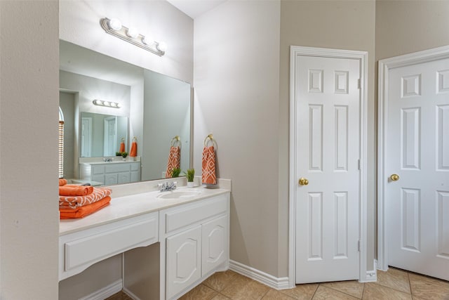 bathroom with tile patterned floors and vanity