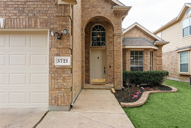 doorway to property featuring a garage