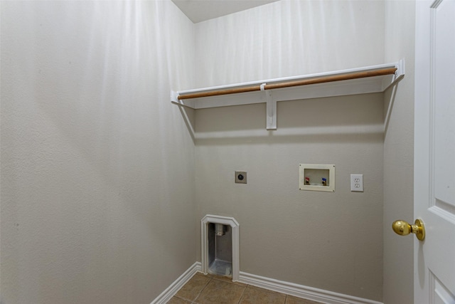 laundry area with hookup for a washing machine, hookup for an electric dryer, and tile patterned floors