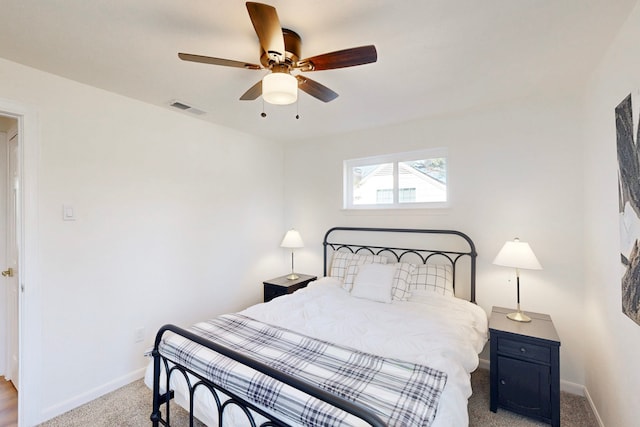 bedroom with light carpet and ceiling fan