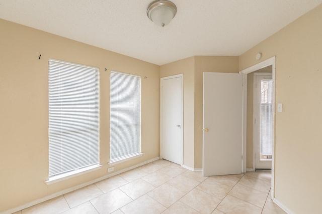 view of tiled spare room