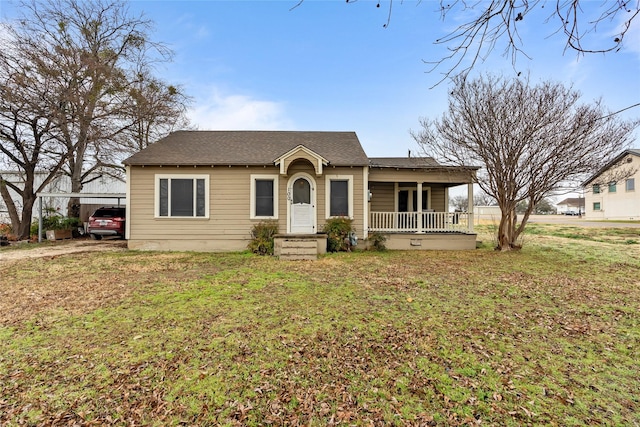 ranch-style home with a front lawn and covered porch