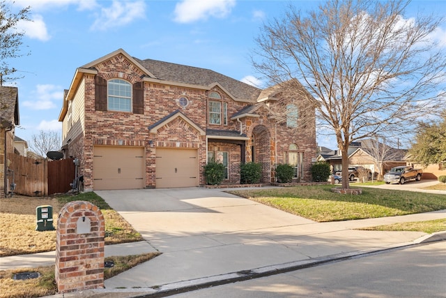 view of front of home featuring a garage and a front yard