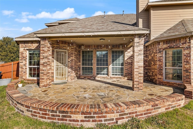 1300 Spanish Needle Trl, Fort Worth, TX 76177 - rear view of property with fence, a chimney, brick siding, roof with shingles, and a patio area