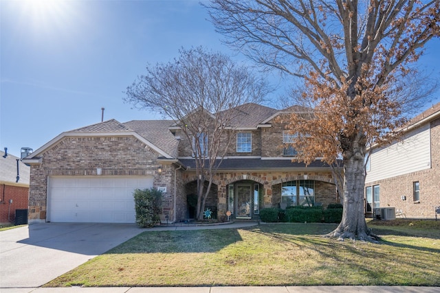 view of front facade with a garage, driveway, central AC unit, a front yard, and brick siding