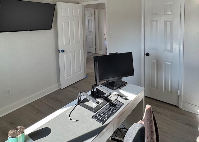 office space featuring wood finished floors and baseboards