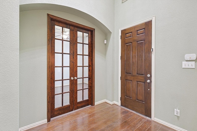 entryway with french doors and hardwood / wood-style flooring