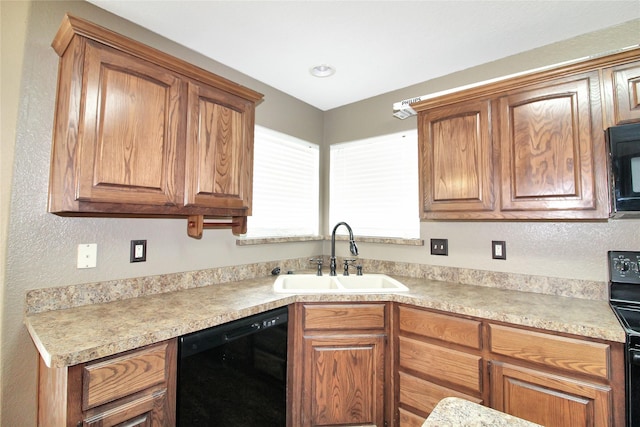 kitchen with sink and black appliances