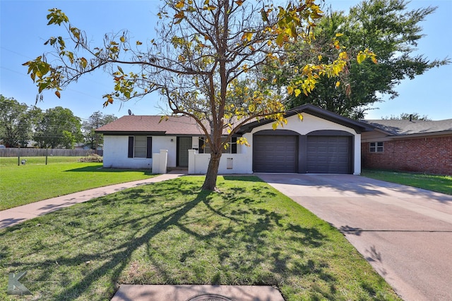 ranch-style house featuring a garage and a front lawn