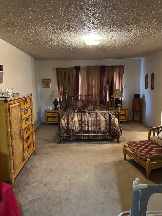 bedroom with carpet flooring and a textured ceiling