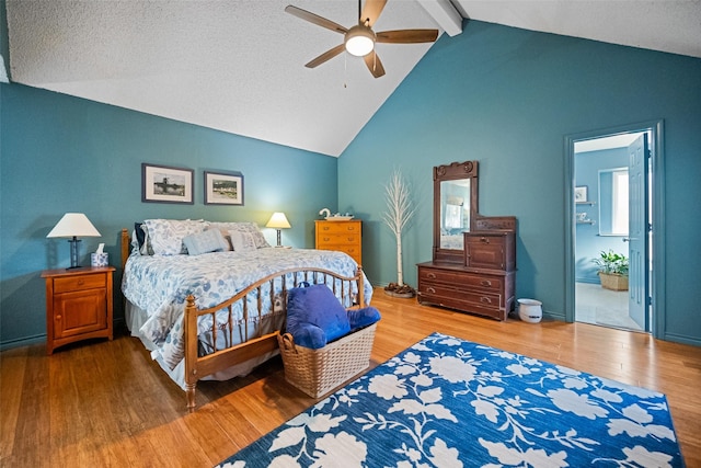 bedroom featuring vaulted ceiling with beams, wood-type flooring, and ceiling fan