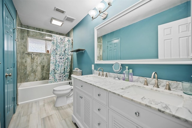 full bathroom featuring shower / tub combo, vanity, and toilet