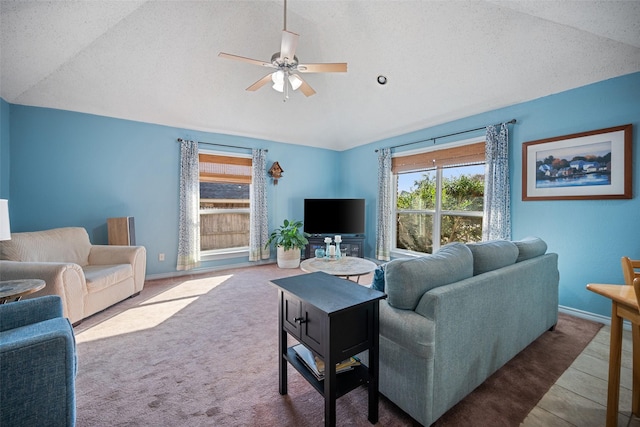 living room with ceiling fan, carpet, and a textured ceiling