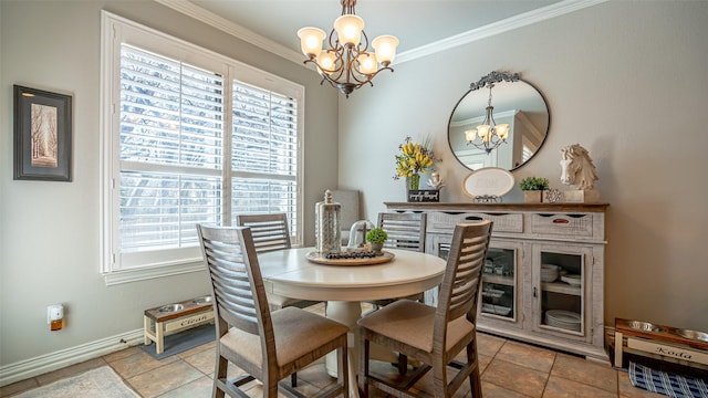 tiled dining area featuring crown molding and a chandelier