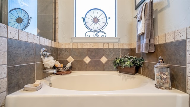 bathroom with a tub to relax in