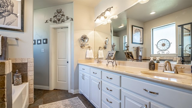 bathroom with vanity and a bathtub