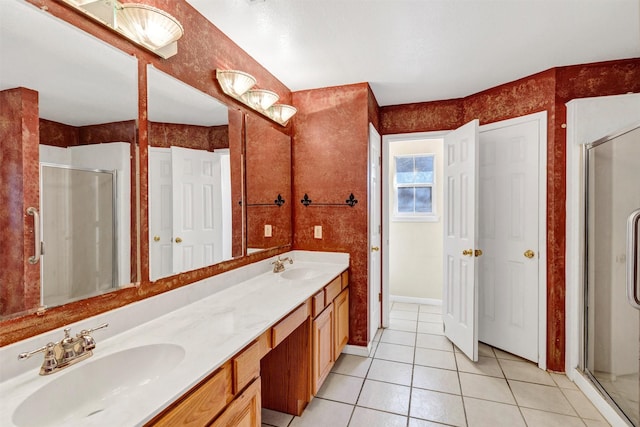 bathroom with walk in shower, vanity, and tile patterned flooring