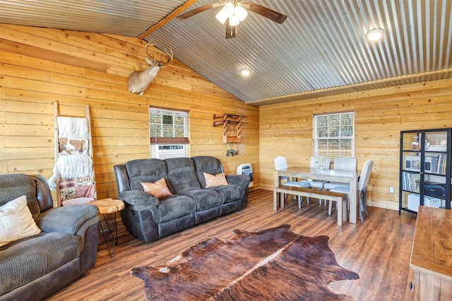 living room with lofted ceiling, hardwood / wood-style floors, ceiling fan, and cooling unit