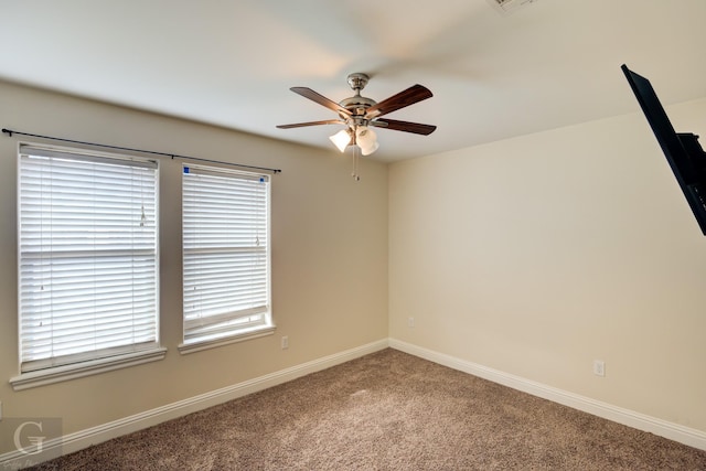 unfurnished room featuring ceiling fan and carpet floors