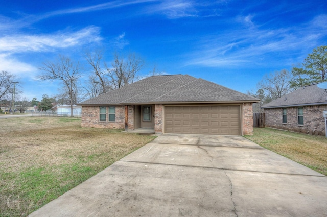 ranch-style house with a garage and a front yard