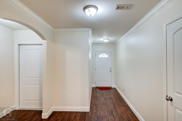 doorway to outside featuring crown molding and dark hardwood / wood-style flooring