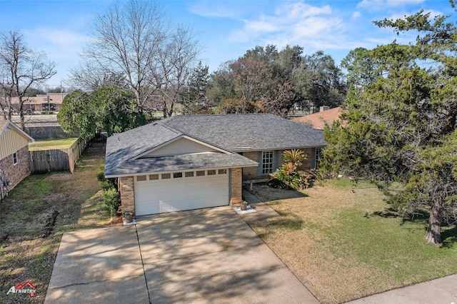 ranch-style house featuring a garage and a front yard