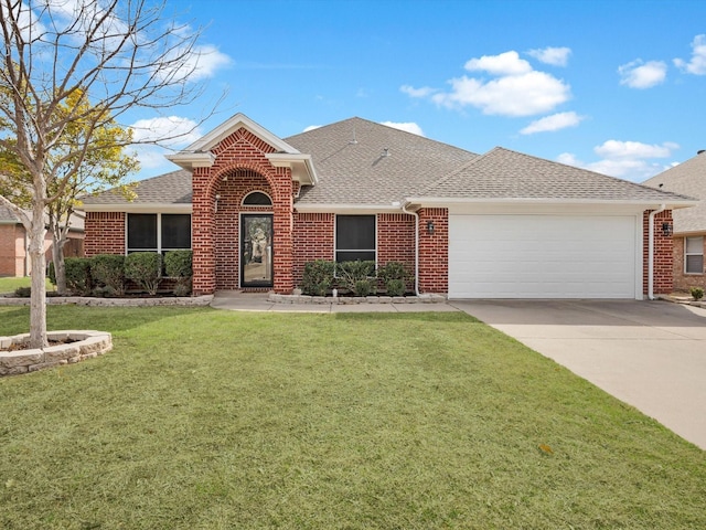 view of front of home with a garage and a front yard