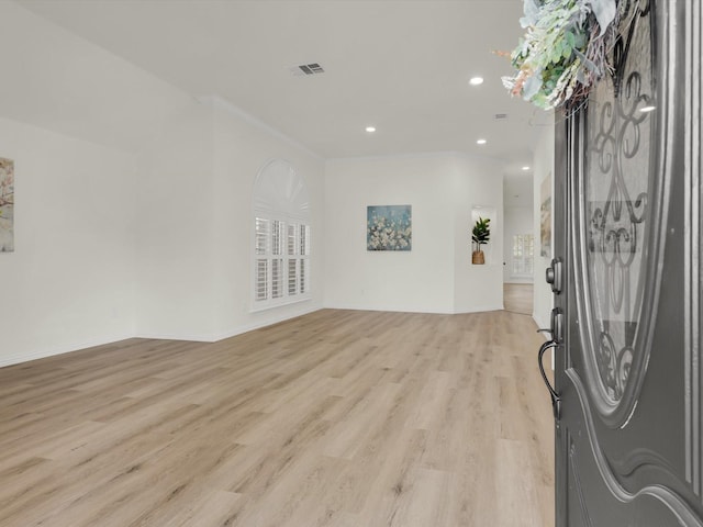 foyer entrance with light hardwood / wood-style flooring