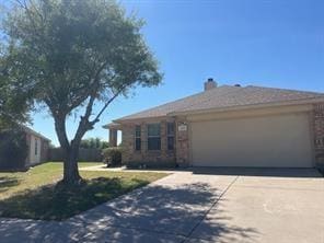 ranch-style house featuring a garage