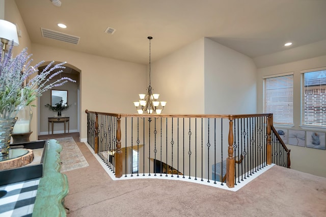 1844 Halifax St, Roanoke, TX 76262 - hall featuring a chandelier, carpet flooring, recessed lighting, an upstairs landing, and arched walkways