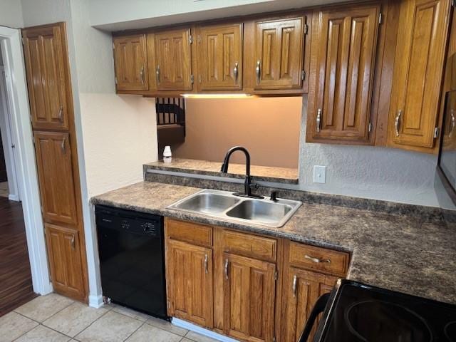 kitchen with light tile patterned flooring, dishwasher, sink, and electric range