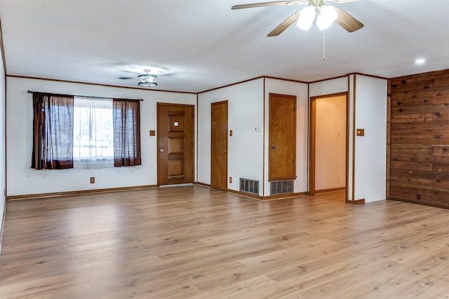 unfurnished room featuring crown molding, ceiling fan, and light hardwood / wood-style floors