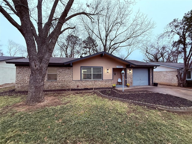 single story home with a garage and a front lawn