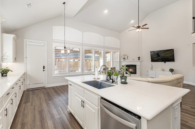 kitchen featuring sink, white cabinetry, dark hardwood / wood-style floors, dishwasher, and an island with sink