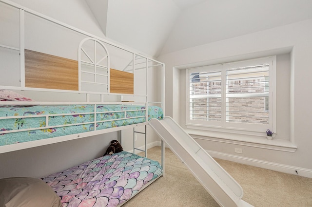 carpeted bedroom featuring lofted ceiling