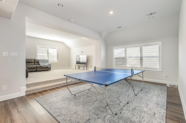 recreation room featuring hardwood / wood-style flooring and vaulted ceiling