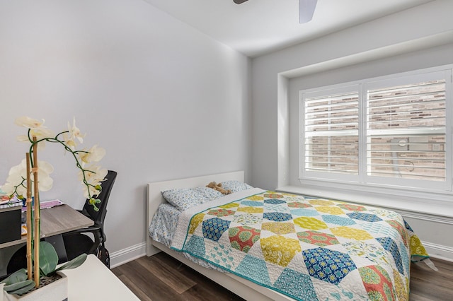 bedroom featuring ceiling fan and dark hardwood / wood-style flooring