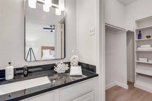 bathroom with vanity, wood-type flooring, and ceiling fan