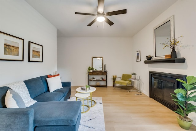 living room with hardwood / wood-style flooring and ceiling fan