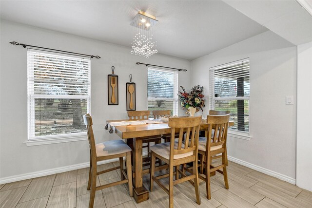 1435 Pioneer Ln, Lowry Crossing, TX 75069 - dining area with baseboards, wood finish floors, and a chandelier