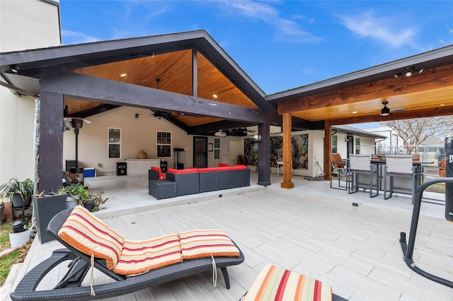 view of patio featuring ceiling fan and an outdoor living space