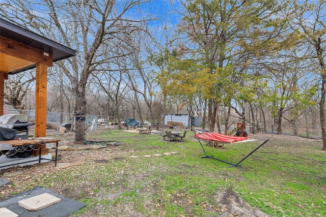 view of yard with a fire pit