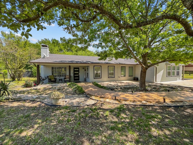 1435 Pioneer Ln, Lowry Crossing, TX 75069 - single story home with a chimney, a patio area, and roof with shingles