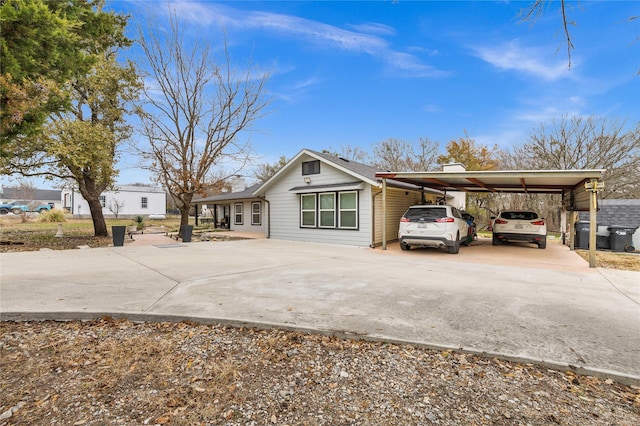 view of front of property featuring a carport