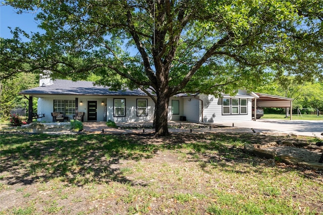 1435 Pioneer Ln, Lowry Crossing, TX 75069 - view of front facade featuring a carport, concrete driveway, and a chimney