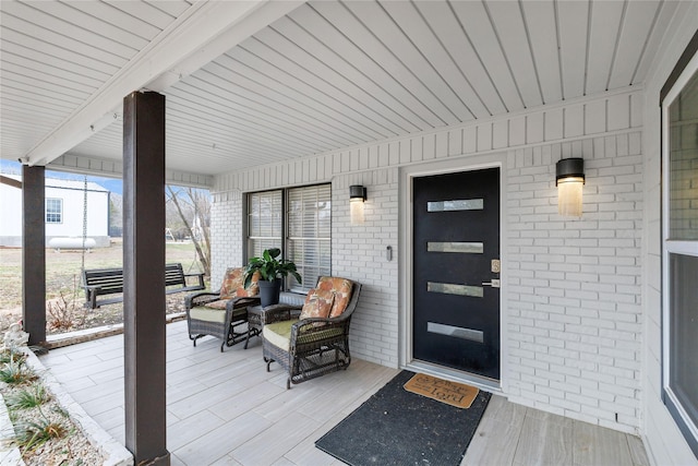 entrance to property with a porch