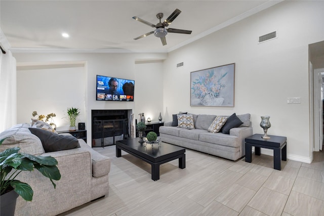 living room featuring ornamental molding, vaulted ceiling, and ceiling fan