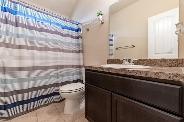 bathroom featuring tile patterned floors, toilet, and vanity